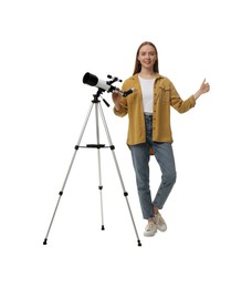 Photo of Young astronomer with telescope showing thumbs up on white background