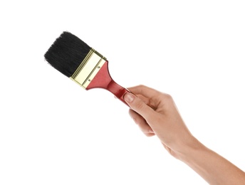 Photo of Woman holding paint brush on white background, closeup