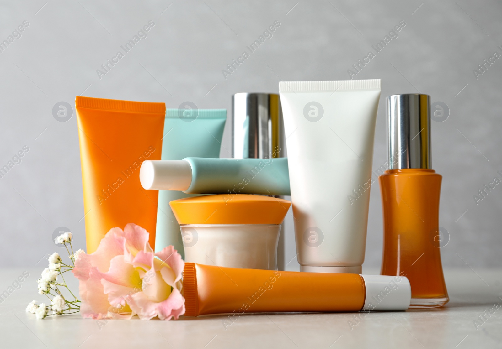 Photo of Set of luxury cosmetic products on light table
