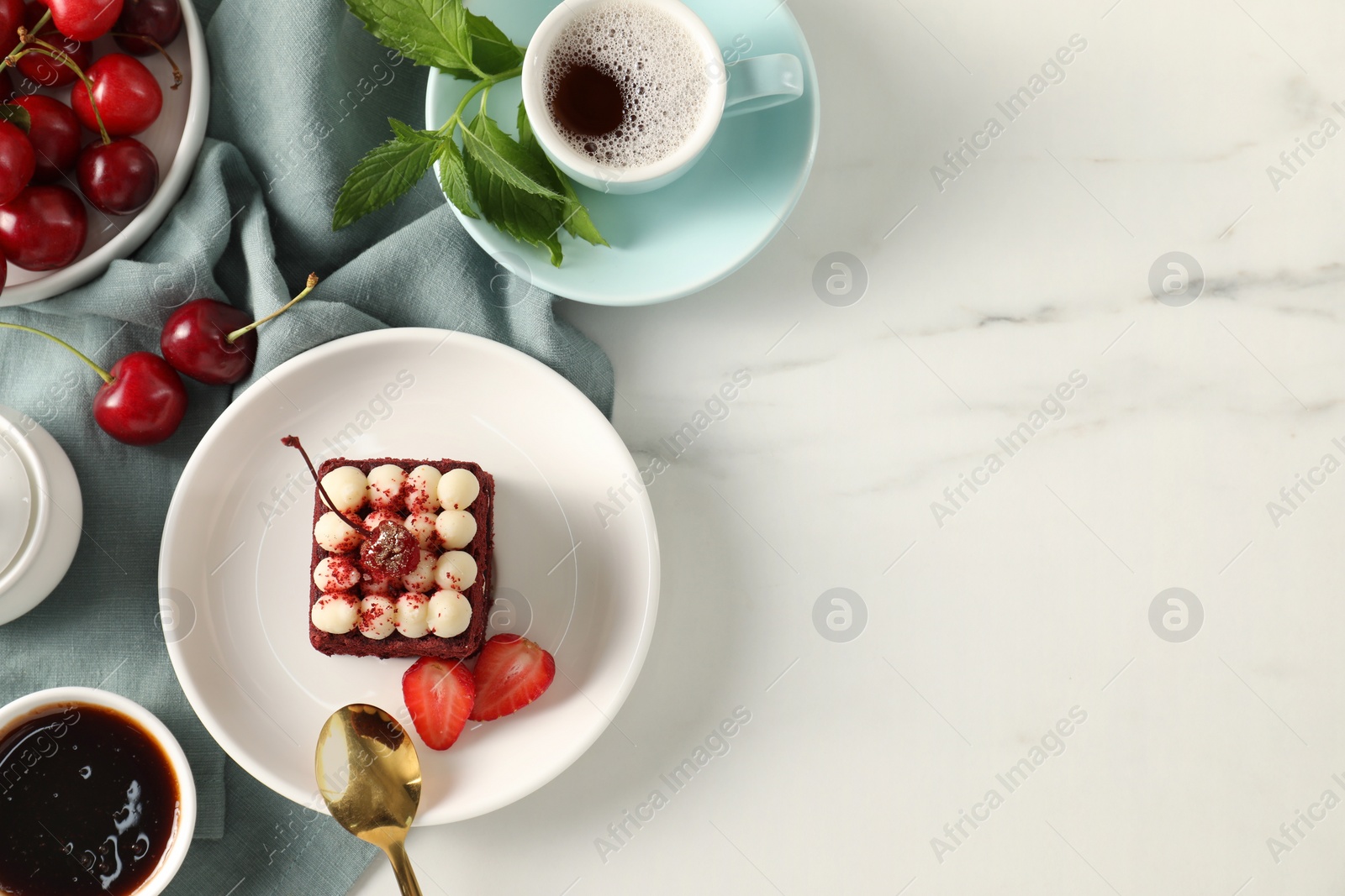 Photo of Piece of delicious red velvet cake with fresh berries served on white marble table, flat lay. Space for text