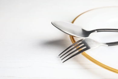 Photo of Elegant table setting on light background, closeup