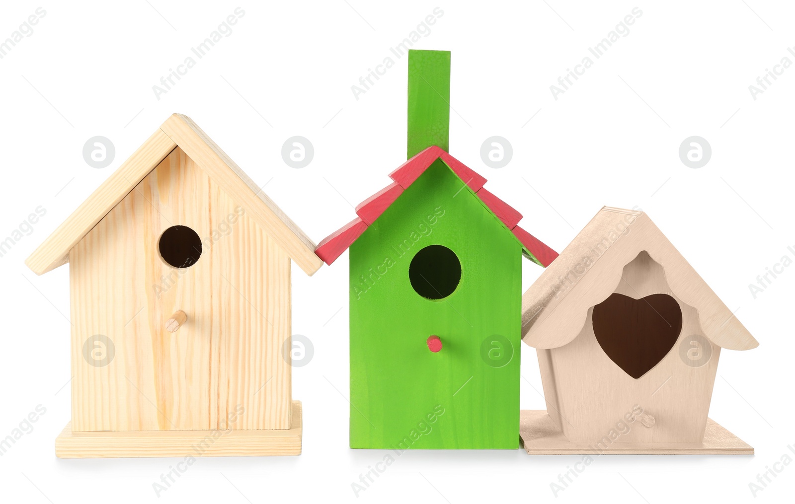 Photo of Three different bird houses on white background