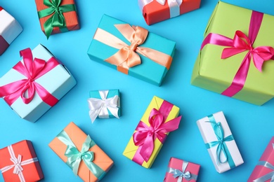 Photo of Flat lay composition with beautiful gift boxes on color background