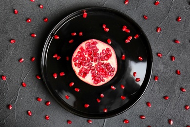 Plate with pomegranate on dark background