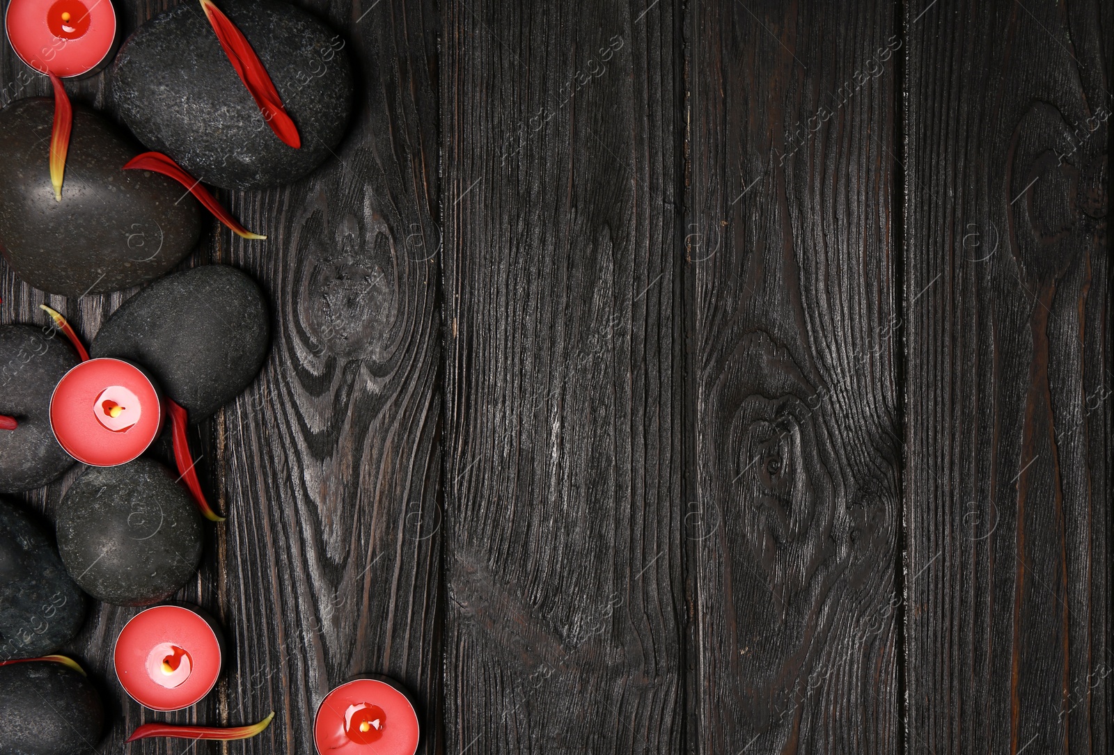 Photo of Flat lay composition with spa stones and space for text on wooden background