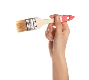 Woman holding paint brush on white background, closeup