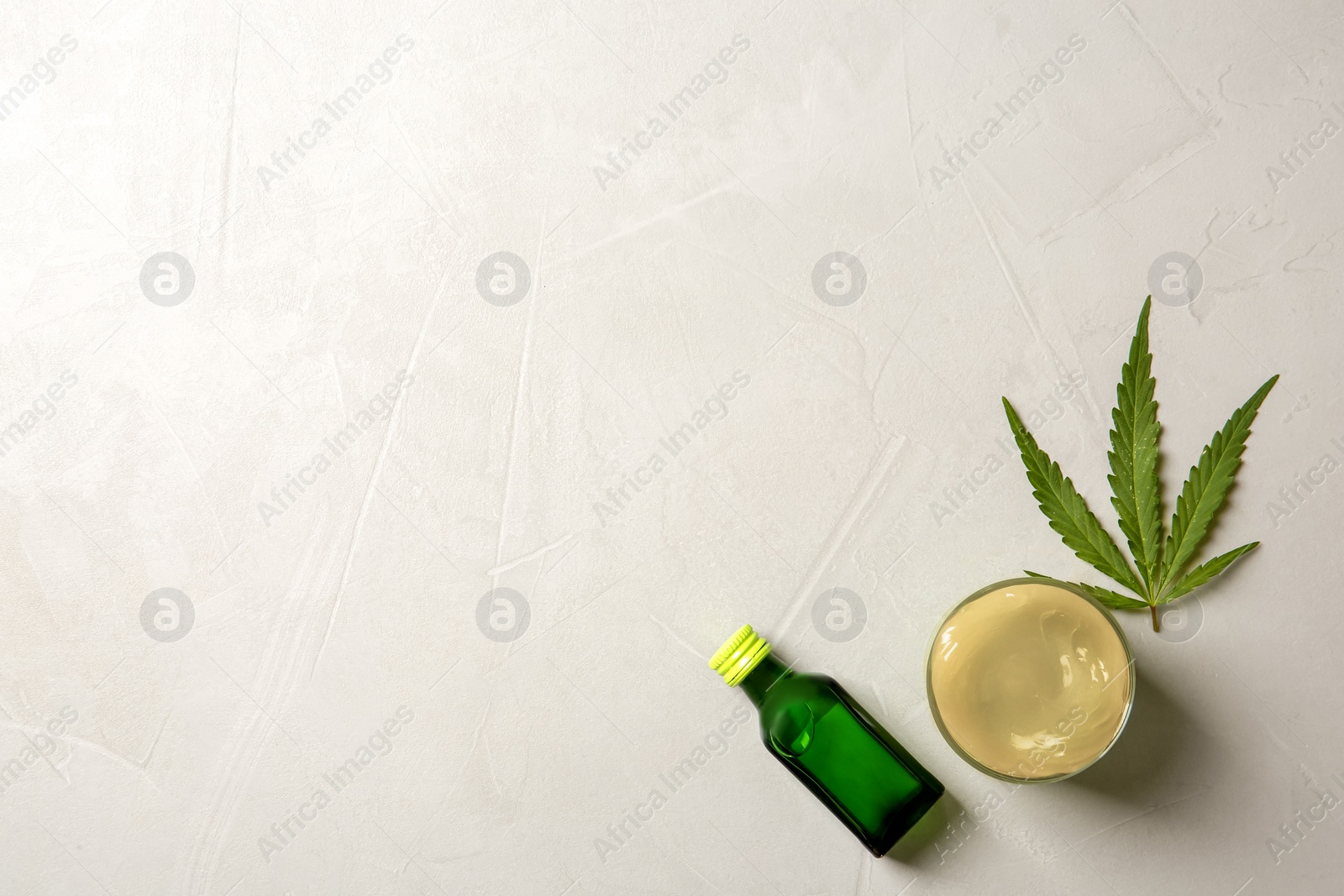 Photo of Flat lay composition with hemp lotion and space for text on grey background