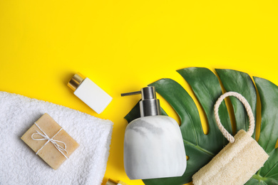 Photo of Flat lay composition with marble soap dispenser on yellow background. Space for text