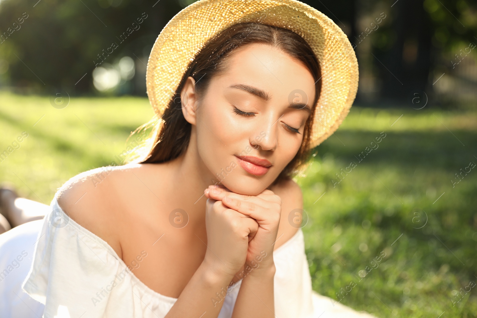 Photo of Beautiful young woman in park on sunny day