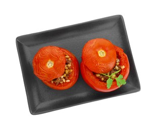 Photo of Plate of delicious stuffed tomatoes isolated on white, top view