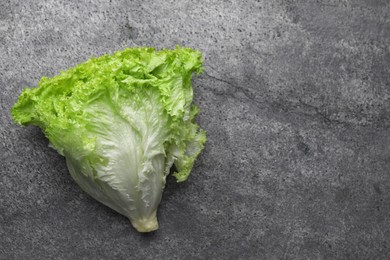 Fresh lettuce on stone table, top view and space for text