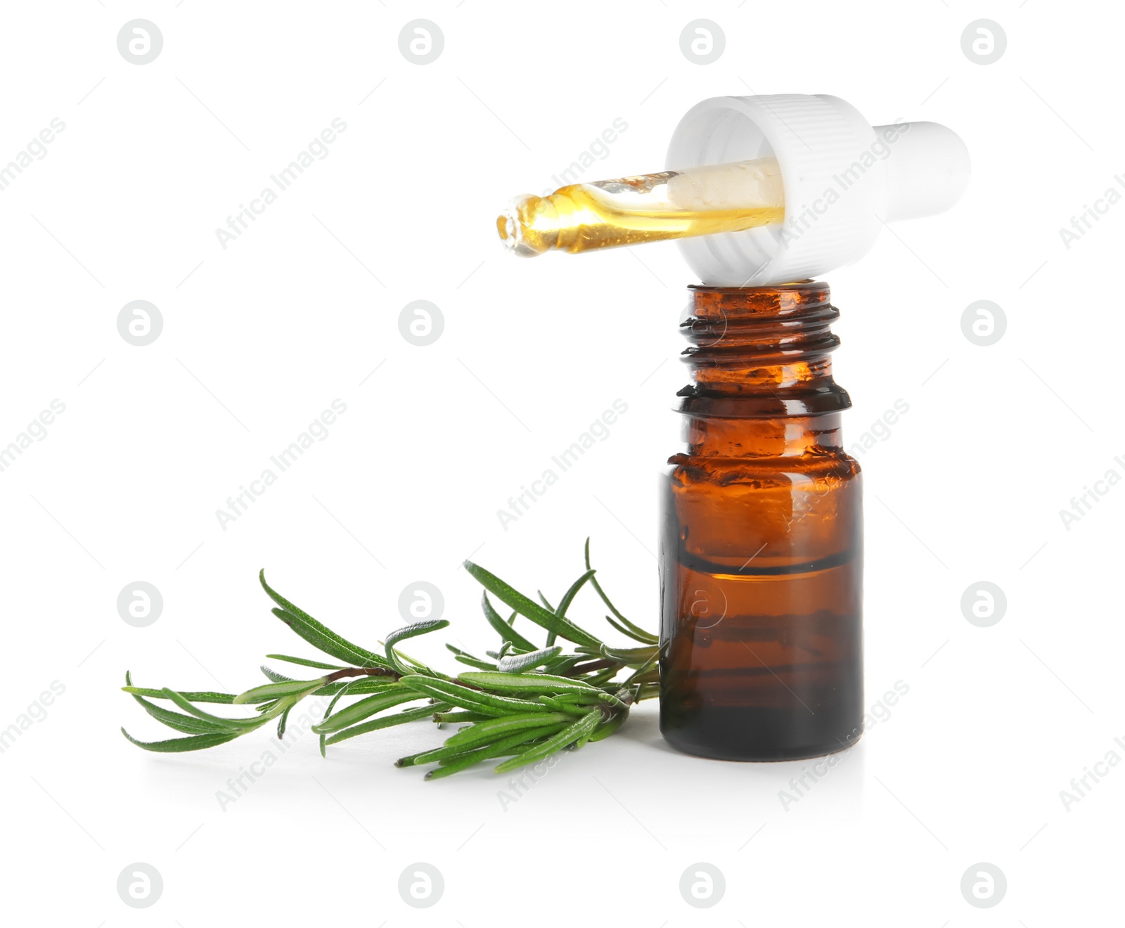 Photo of Small bottle with rosemary oil and fresh twig on white background