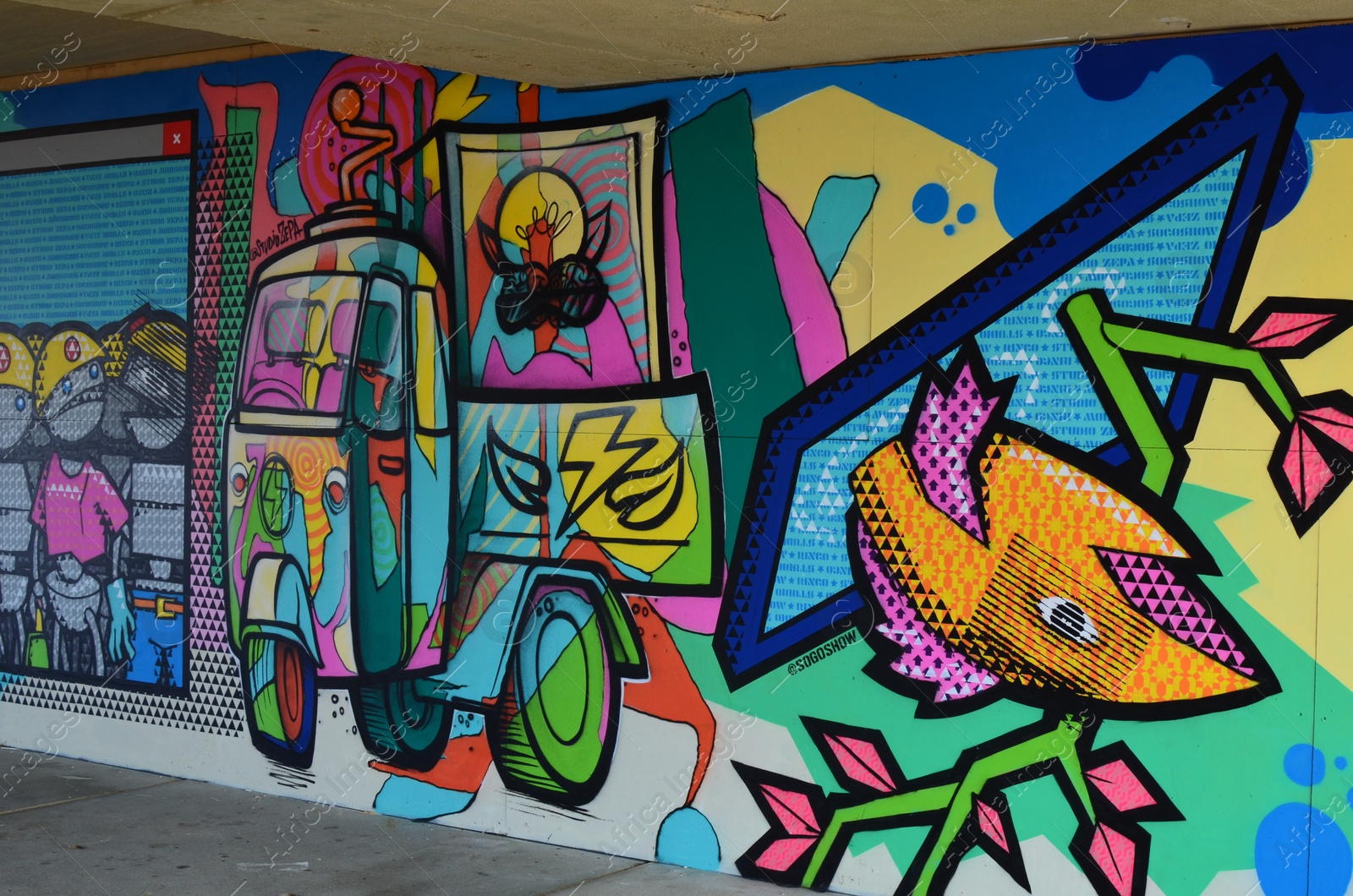 Photo of HAGUE, NETHERLANDS - SEPTEMBER 10, 2022: Colorful graffiti drawn on wall outdoors