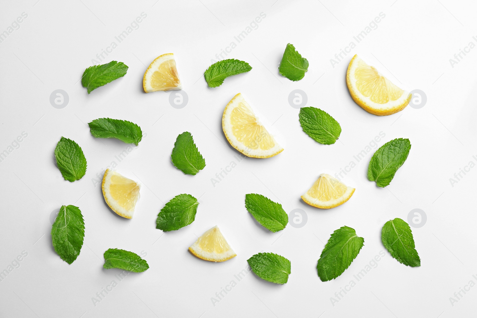 Photo of Fresh mint with sliced lemon on white background, flat lay