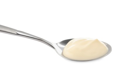 Photo of Metal spoon with mayonnaise isolated on white