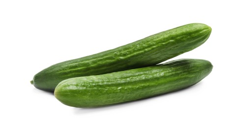 Photo of Two long fresh cucumbers isolated on white