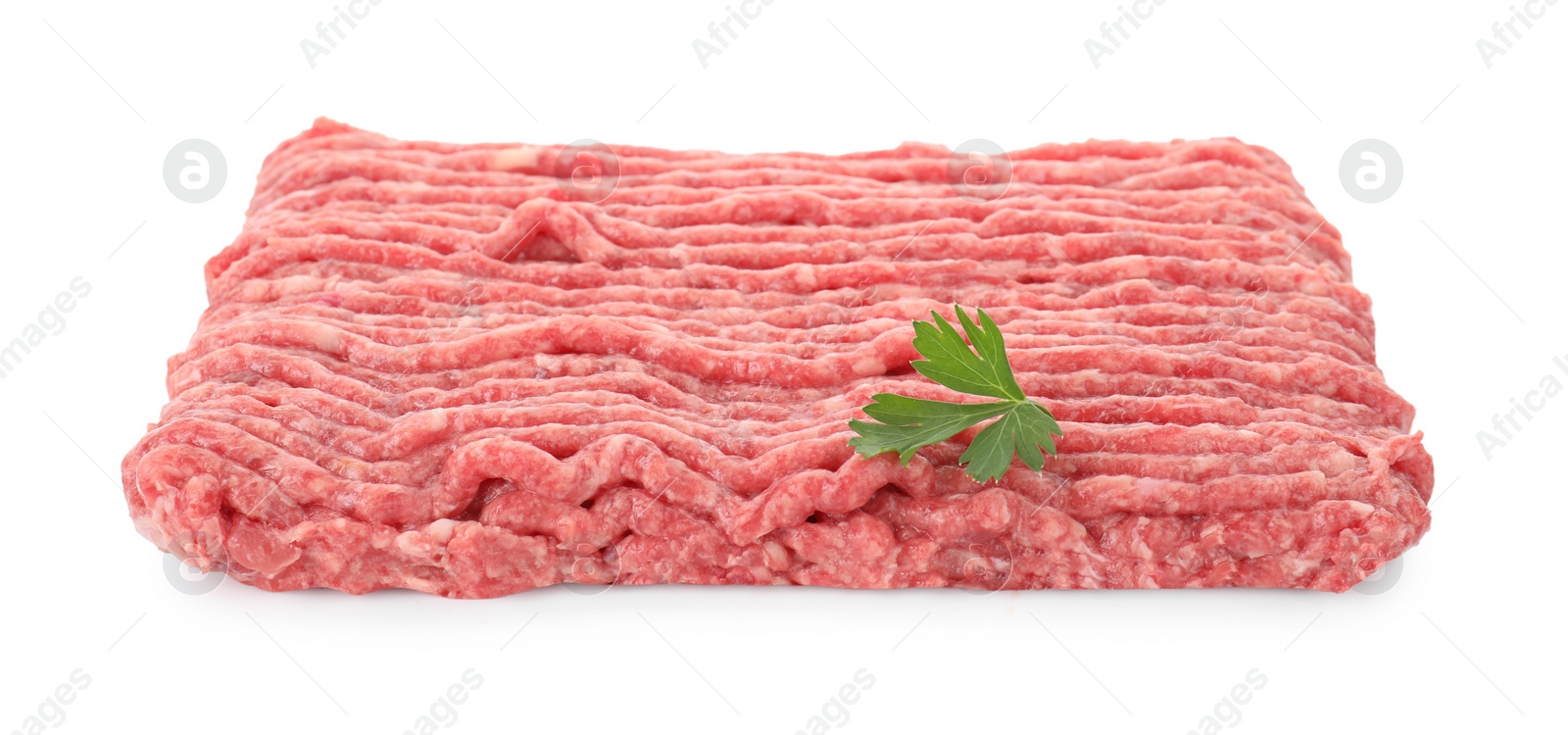 Photo of Raw ground meat and parsley isolated on white