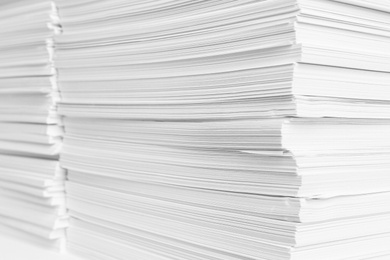 Photo of Stacks of white paper sheets, closeup view