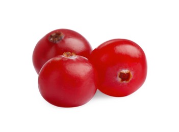 Three fresh ripe cranberries isolated on white