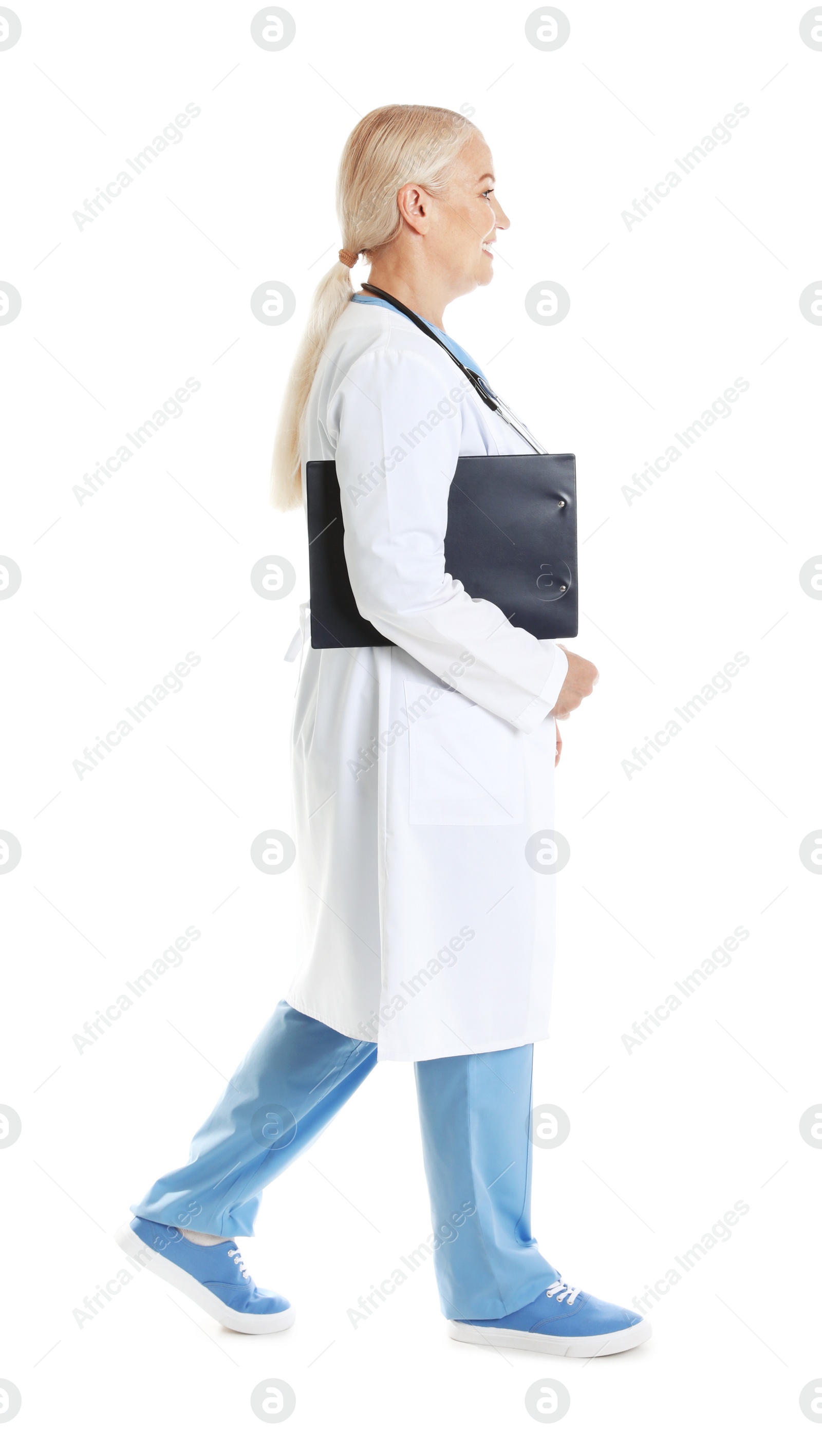 Photo of Full length portrait of female doctor with clipboard isolated on white. Medical staff