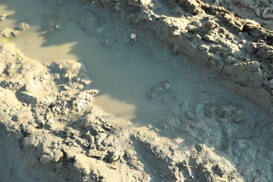 View of textured ground mud outdoors on sunny day