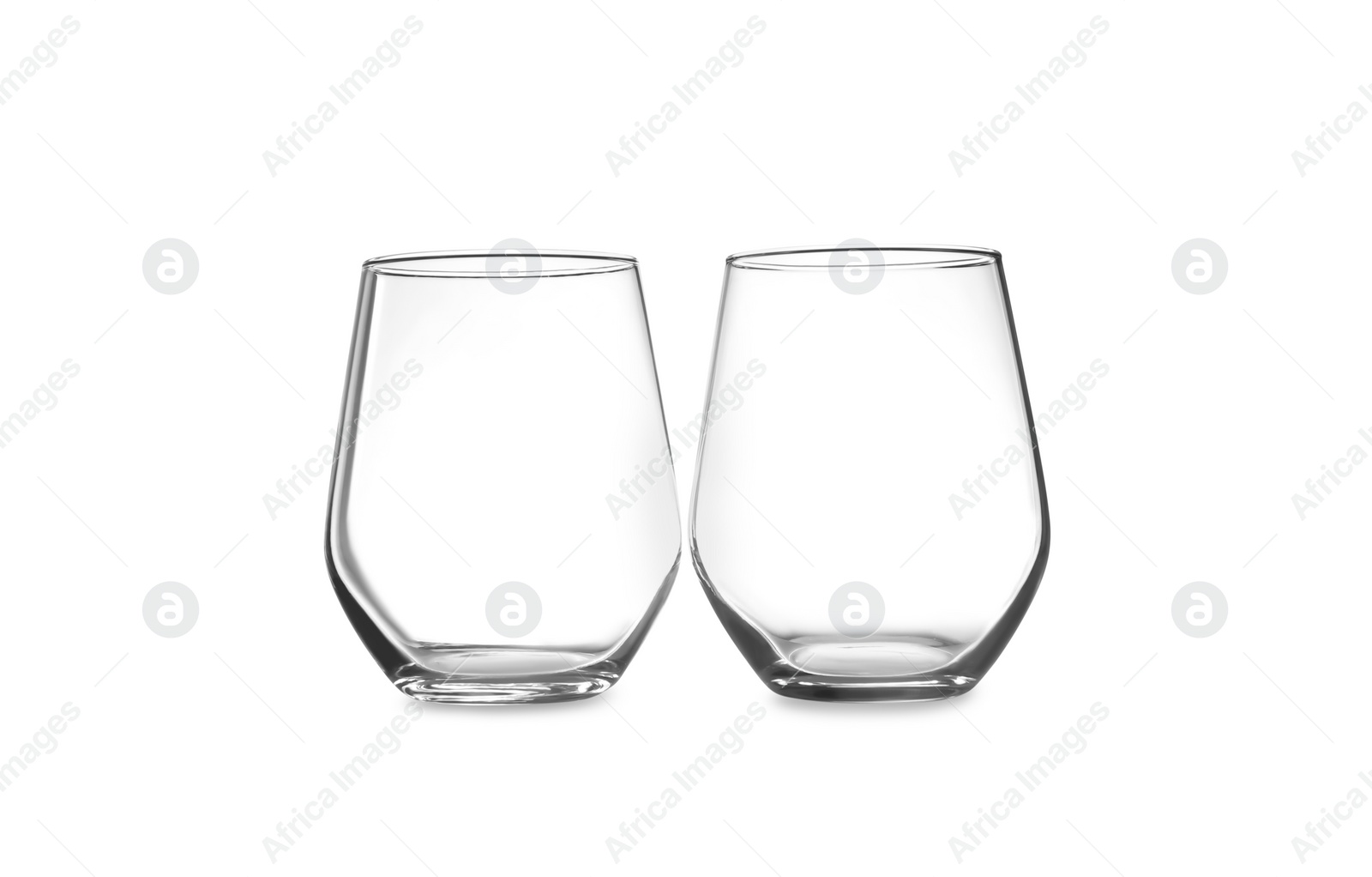 Photo of New clean empty glasses isolated on white