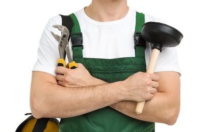 Young plumber with adjustable wrench and force cup on white background