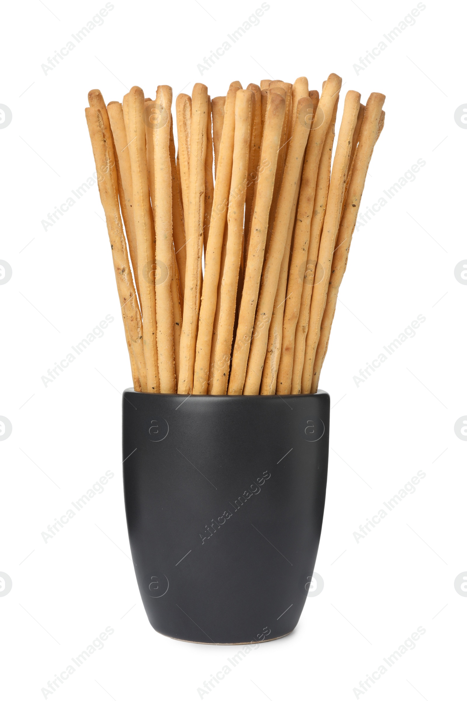 Photo of Delicious grissini sticks in cup on white background