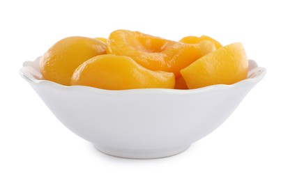 Halves of canned peaches in bowl isolated on white