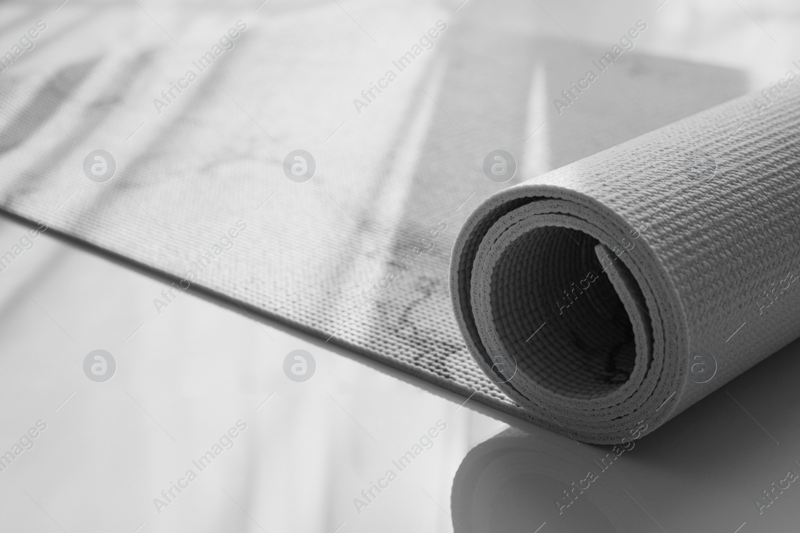 Photo of Karemat or fitness mat on floor indoors, closeup