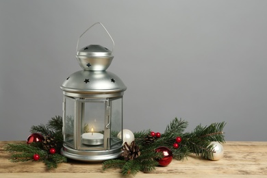 Lantern and Christmas decorations on grey background, space for text