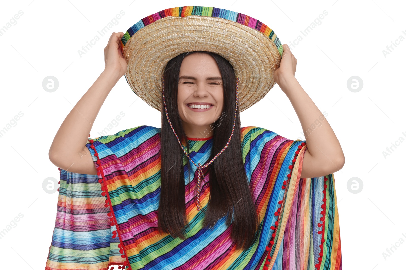 Photo of Young woman in Mexican sombrero hat and poncho on white background