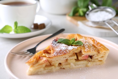 Photo of Slice of traditional apple pie on plate, closeup