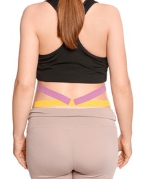Closeup of sporty pregnant woman with kinesio tapes on white background, back view