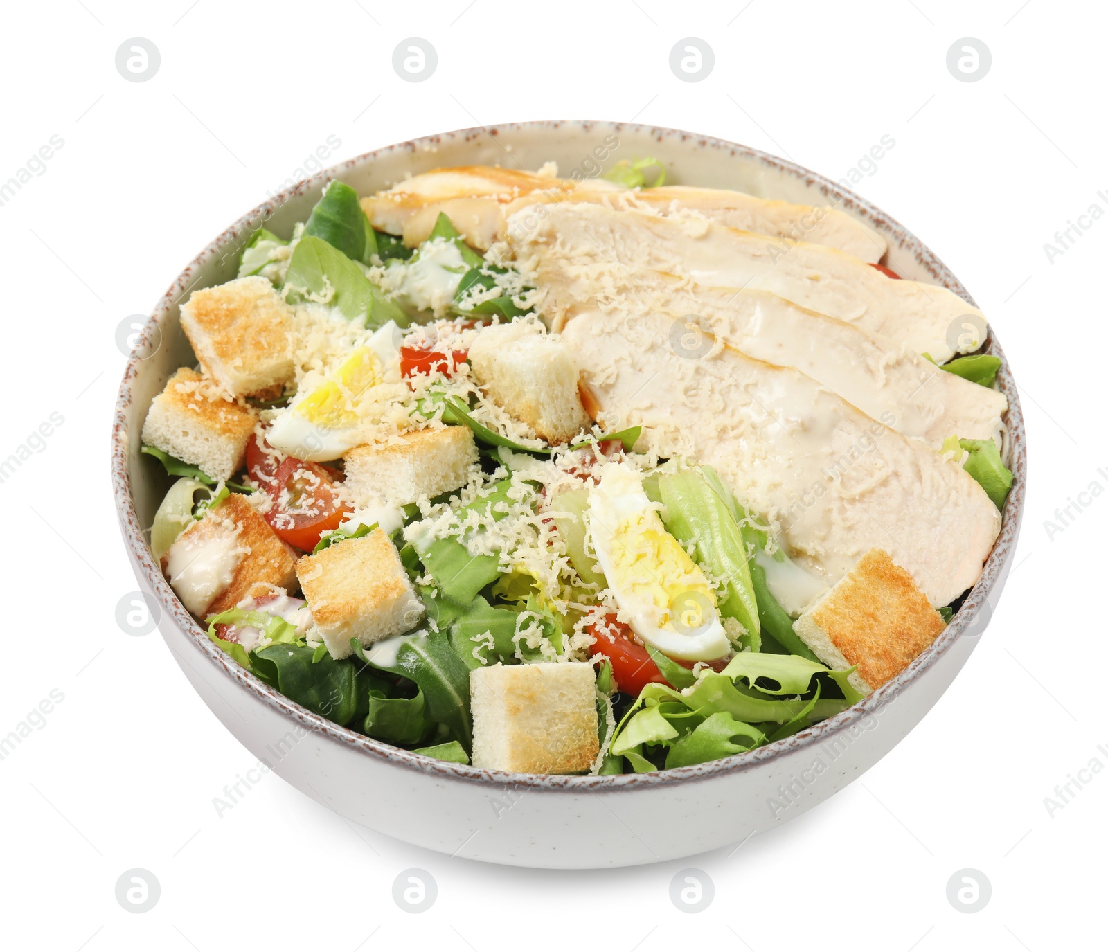 Photo of Delicious Caesar salad in bowl isolated on white