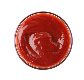 Photo of Tasty ketchup in glass bowl isolated on white, top view