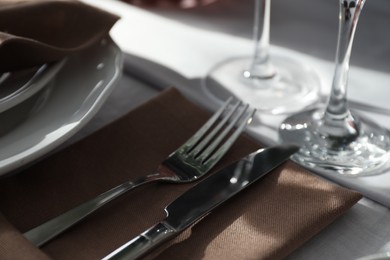 Photo of Beautiful place setting for festive dinner on table, closeup