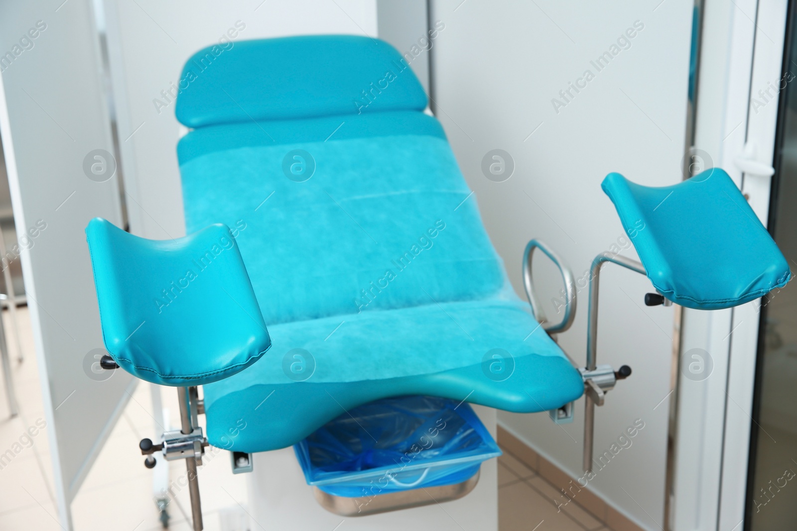 Photo of Gynecological examination chair in doctor's office. Health checkup