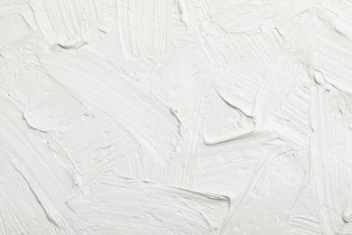 Texture of white oil paint as background, closeup