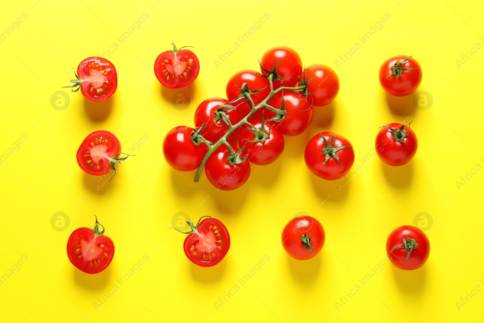 Photo of Flat lay composition with ripe cherry tomatoes on color background