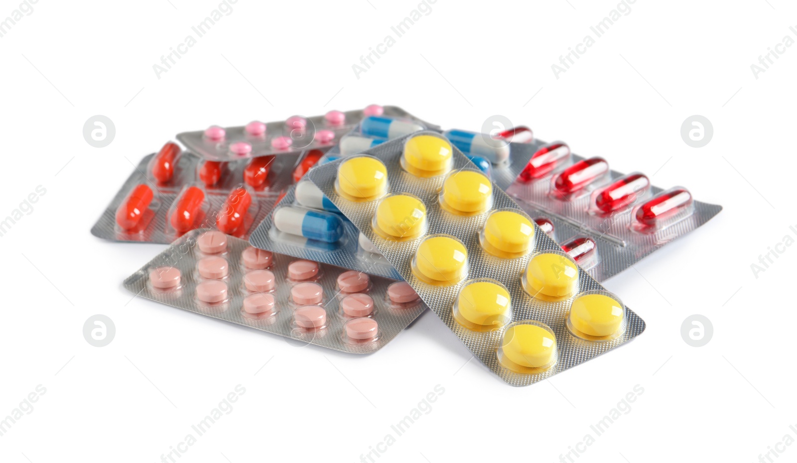 Photo of Blisters with different pills on white background