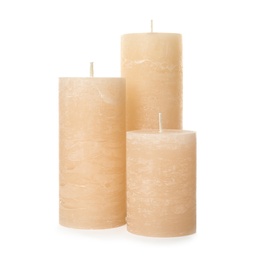 Three color wax candles on white background