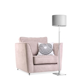 Photo of Comfortable armchair with pillow and lamp on white background. Interior element