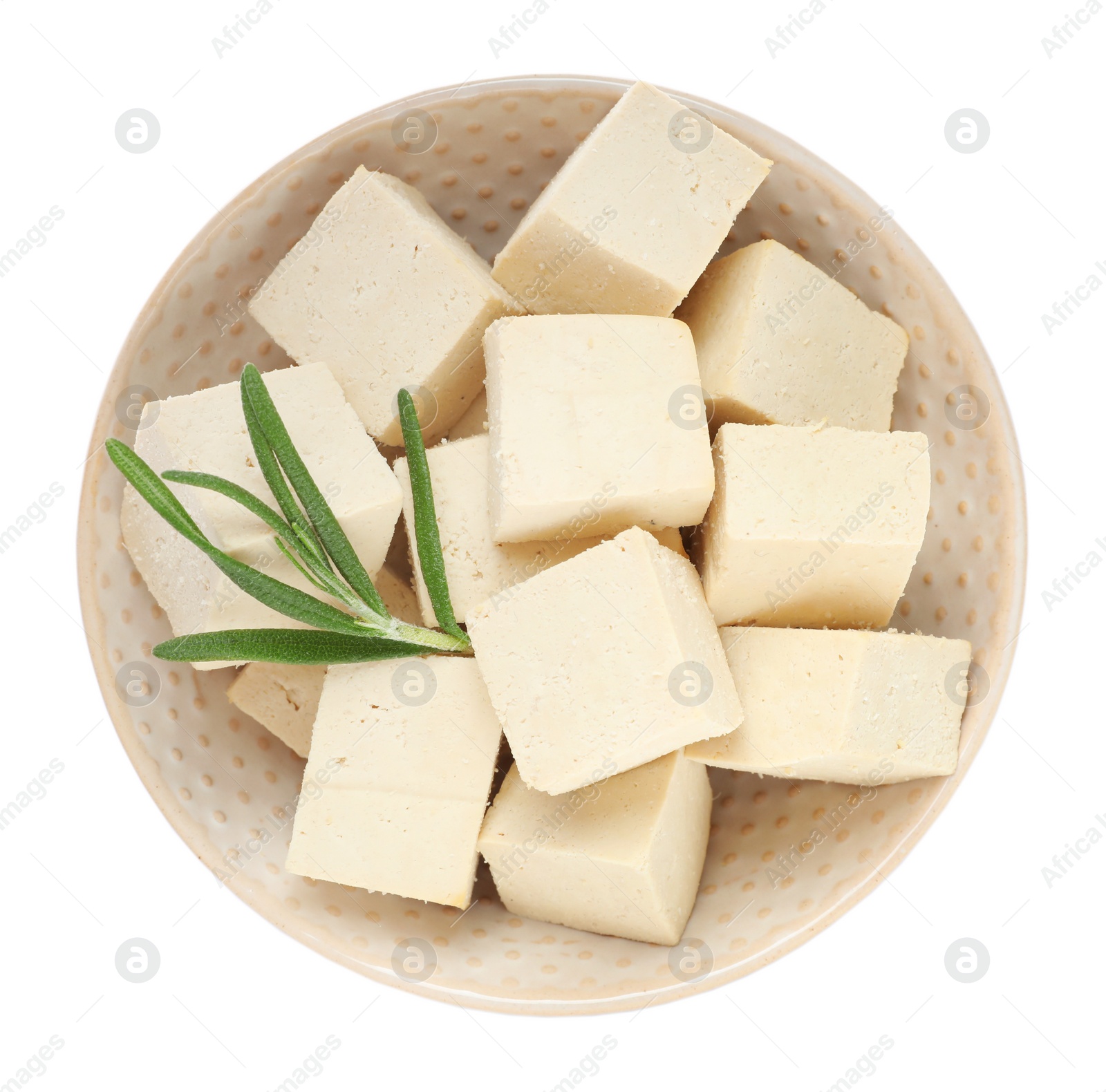 Photo of Bowl with delicious raw tofu pieces and rosemary on white background, top view