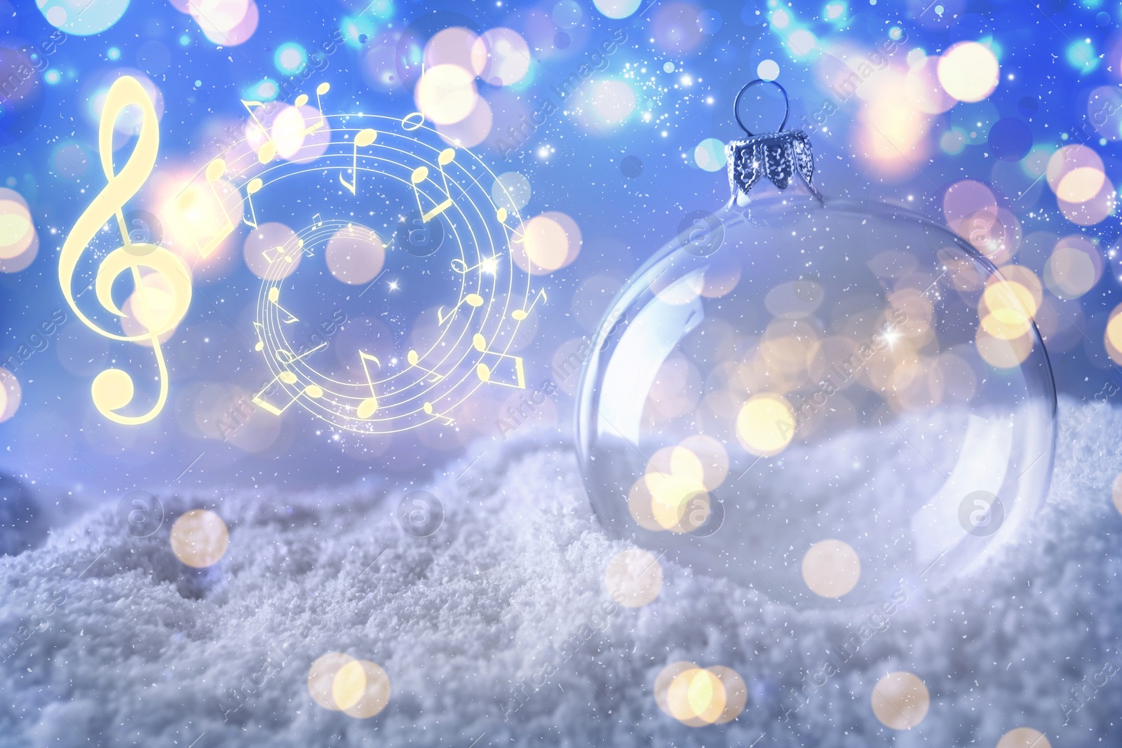Image of Music notes and Christmas ball on snow, bokeh effect