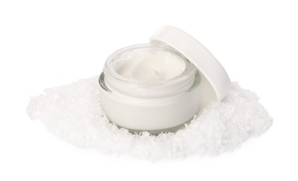 Photo of Jar of hand cream and decorative snow isolated on white. Winter skin care