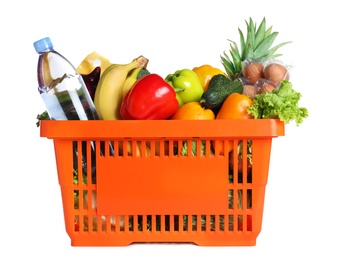 Photo of Shopping basket with grocery products on white background