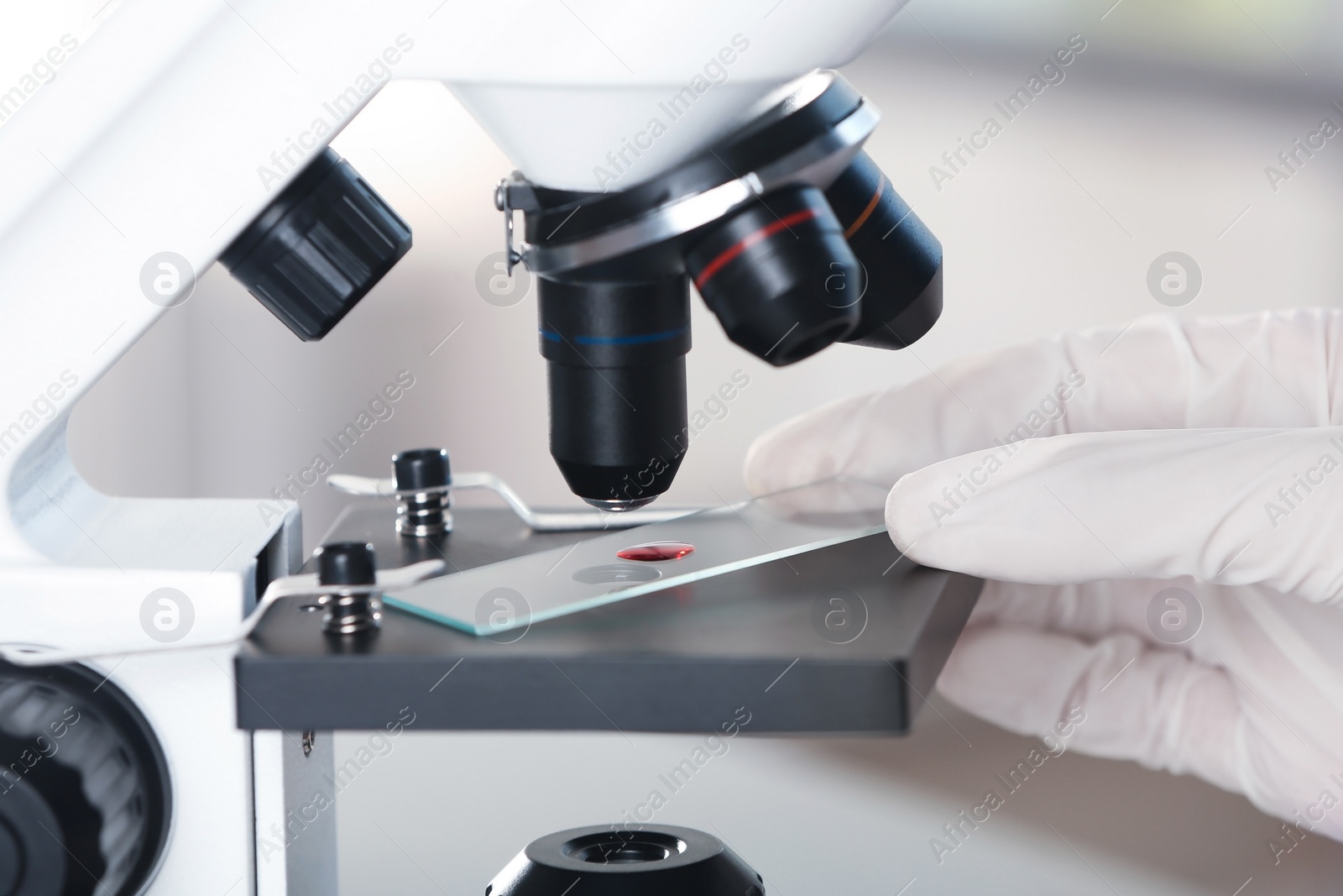 Photo of Analyst doing laboratory test with microscope, closeup. Chemical analysis