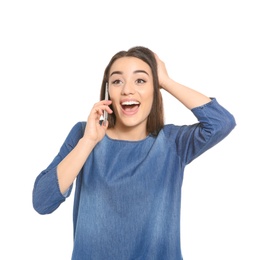 Attractive young woman talking on mobile phone against white background