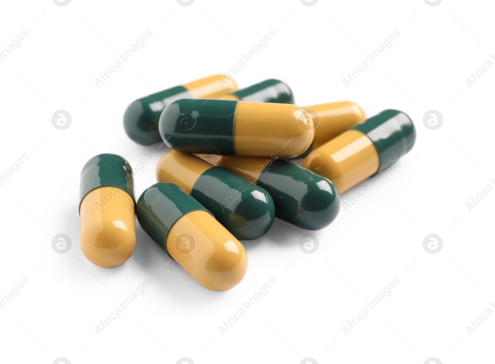 Photo of Many pills isolated on white. Medicinal treatment